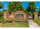 Elegant brick entrance sign with lush landscaping, welcoming residents and visitors to Three Bridges at 4236 Tacoma Trce, Suwanee, GA 30024