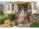 Welcoming entrance with lovely potted flowers and decorative accents at 4236 Tacoma Trce, Suwanee, GA 30024