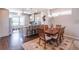 Open kitchen and dining area with hardwood floors and granite countertops at 4236 Tacoma Trce, Suwanee, GA 30024