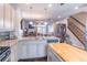 Bright kitchen boasts stainless steel appliances, granite countertops, and a functional center island at 4236 Tacoma Trce, Suwanee, GA 30024