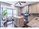 Bright kitchen with stainless steel appliances, granite countertops, and wooden island at 4236 Tacoma Trce, Suwanee, GA 30024