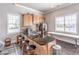 Clubhouse kitchenette featuring granite countertops, stainless steel appliances, and bar stool seating at 4236 Tacoma Trce, Suwanee, GA 30024