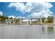 Lake with a fountain in a community park featuring an overhead pedestrian bridge at 4236 Tacoma Trce, Suwanee, GA 30024