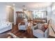 Open-concept living area with hardwood floors, ample seating, and abundant natural light at 4236 Tacoma Trce, Suwanee, GA 30024