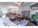 Spacious living area featuring an open floor plan, hardwood floors, and natural light at 4236 Tacoma Trce, Suwanee, GA 30024
