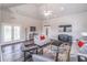 A living room with modern decor, comfortable seating, a ceiling fan and ample lighting at 4236 Tacoma Trce, Suwanee, GA 30024