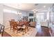 Open-concept living room with hardwood floors, fireplace, and lots of natural light at 4236 Tacoma Trce, Suwanee, GA 30024