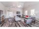 Bright living room featuring gray walls, wood floors, comfortable seating and abundant natural light at 4236 Tacoma Trce, Suwanee, GA 30024
