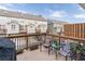 Cozy patio with comfortable seating, potted plants, and a grill, perfect for outdoor relaxation at 4236 Tacoma Trce, Suwanee, GA 30024
