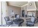 A patio with comfortable seating, a fireplace, and a view of the pool at 4236 Tacoma Trce, Suwanee, GA 30024