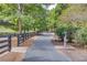 Walking path in the park surrounded by greenery and a fence at 4236 Tacoma Trce, Suwanee, GA 30024