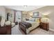 Comfortable bedroom with a cozy bed, stylish decor, and a view of the outdoors at 6565 Bentley Ridge Dr, Cumming, GA 30040