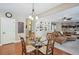 Open dining area with view to living room and kitchen at 6565 Bentley Ridge Dr, Cumming, GA 30040