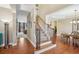 Welcoming entry with hardwood floors and staircase leading to the second floor at 6565 Bentley Ridge Dr, Cumming, GA 30040
