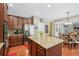 Kitchen with large island, stainless appliances, hardwood floors, and eat-in area at 6565 Bentley Ridge Dr, Cumming, GA 30040