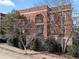 Exterior view of a brick apartment building with an arched entry and balcony at 802 Frederica Ne St # 5, Atlanta, GA 30306