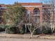 Exterior of a beautiful brick apartment building with an arched entry and balcony at 802 Frederica Ne St # 5, Atlanta, GA 30306