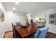 Bright dining room shows rustic wood table, seating for six, and open access to the adjacent living area at 802 Frederica Ne St # 5, Atlanta, GA 30306