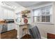 This compact kitchen features white cabinets and stainless steel appliances. A perfect spot for a quick bite at 802 Frederica Ne St # 5, Atlanta, GA 30306