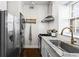 This modern kitchen features stainless steel appliances, granite counters, and ample natural light from the window at 802 Frederica Ne St # 5, Atlanta, GA 30306