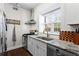 Updated kitchen featuring stainless appliances, granite counters, a gas range, and a modern vent hood at 802 Frederica Ne St # 5, Atlanta, GA 30306