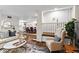 Cozy living room featuring a comfortable sofa, stylish coffee table and hardwood floors at 802 Frederica Ne St # 5, Atlanta, GA 30306