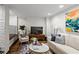 Bright living room featuring hardwood floors, plush seating, and stylish decor at 802 Frederica Ne St # 5, Atlanta, GA 30306