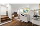 Bright living room featuring hardwood floors, stylish decor, and stairs leading to the second level at 802 Frederica Ne St # 5, Atlanta, GA 30306