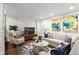 Comfortable living room with hardwood floors, plush seating, and stylish decor at 802 Frederica Ne St # 5, Atlanta, GA 30306