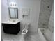 Modern bathroom features a tub and shower combo with stylish vanity and marble tile at 981 Dundee Dr, Lilburn, GA 30047