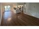 Spacious living room featuring hardwood floors, and a large sliding glass door to a wood deck at 981 Dundee Dr, Lilburn, GA 30047