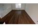 Upstairs living room with sleek, dark floors and a large picture window at 981 Dundee Dr, Lilburn, GA 30047