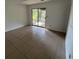 Bright living room boasts sliding glass door access to the backyard area at 981 Dundee Dr, Lilburn, GA 30047