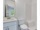 New bathroom with a white vanity, toilet and tiled shower at 1304 Six Sisters St, Dacula, GA 30019