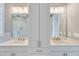 Bathroom featuring a double vanity, modern lighting, and a glass shower at 1304 Six Sisters St, Dacula, GA 30019
