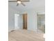 Bedroom featuring bright white walls, hardwood flooring, and a walk-in closet at 1304 Six Sisters St, Dacula, GA 30019