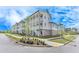 Apartment building exterior featuring balconies, brick accents, and landscaping at 1304 Six Sisters St, Dacula, GA 30019