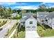 Two-story home with white siding and two car garage surrounded by green grass at 1304 Six Sisters St, Dacula, GA 30019