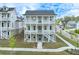 Three-story home with double porches and brick foundation at 1304 Six Sisters St, Dacula, GA 30019