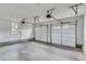 Spacious two car garage with white garage doors at 1304 Six Sisters St, Dacula, GA 30019