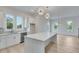 Contemporary kitchen with island, modern lighting, and stainless steel appliances at 1304 Six Sisters St, Dacula, GA 30019