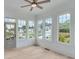 Bright living room with many windows and hardwood floors at 1304 Six Sisters St, Dacula, GA 30019
