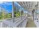 Beautiful covered porch featuring a white railing at 1304 Six Sisters St, Dacula, GA 30019