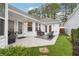 Charming backyard patio with outdoor seating, artificial turf, and attractive landscaping at 142 Jaime Dr, Canton, GA 30114