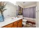 Bathroom featuring vanity, toilet, and shower with striped curtain at 142 Jaime Dr, Canton, GA 30114