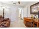 Cozy bedroom featuring a wooden desk, comfortable chair and a lounge at 142 Jaime Dr, Canton, GA 30114