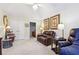 Bright bedroom with a cozy seating area, including leather furniture and tasteful wall art at 142 Jaime Dr, Canton, GA 30114