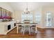 Bright dining area with chandelier, wood floors, and natural light at 142 Jaime Dr, Canton, GA 30114