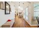Hallway with wood floors leading to dining area, bathed in natural light at 142 Jaime Dr, Canton, GA 30114