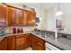 Well-lit kitchen with stainless steel appliances and granite countertops at 142 Jaime Dr, Canton, GA 30114